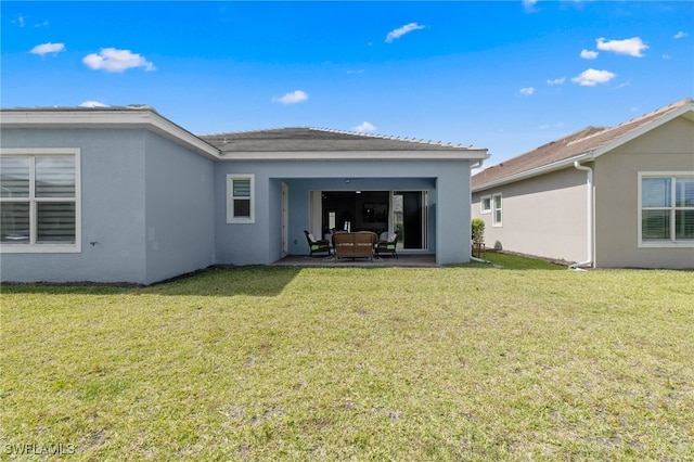 3419 Pilot Cir, Naples, FL 34120 - back of property featuring a lawn and stucco siding