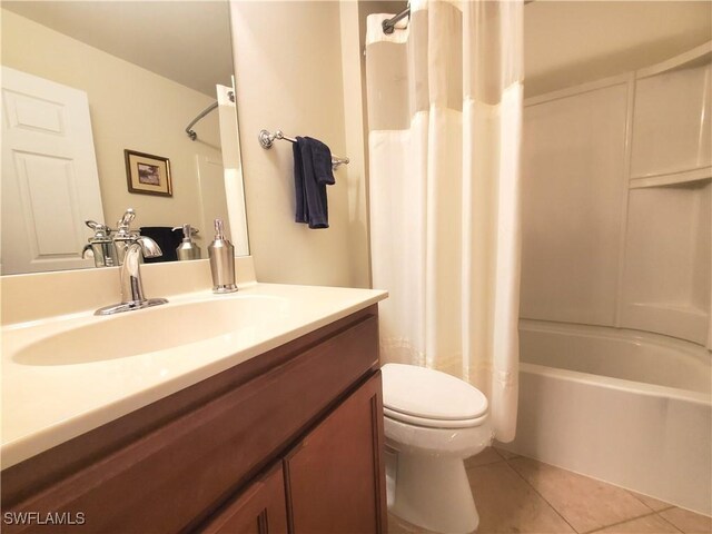 8657 Querce Ct, Naples, FL 34114 - full bath featuring tile patterned floors, toilet, shower / bathtub combination with curtain, and vanity
