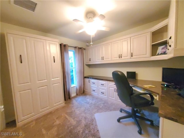 8657 Querce Ct, Naples, FL 34114 - office area with built in desk, light colored carpet, and ceiling fan