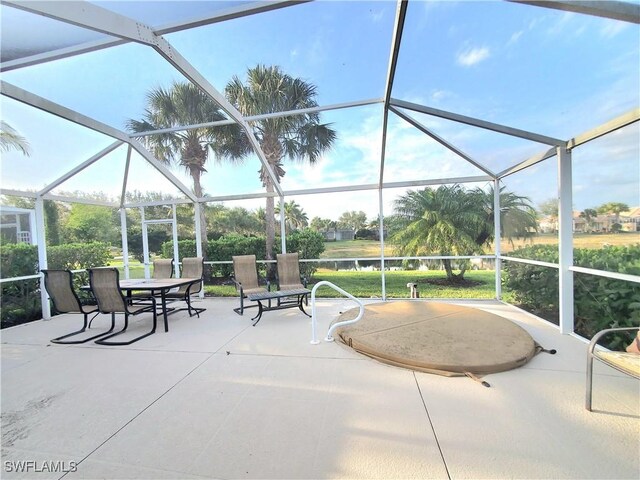 8657 Querce Ct, Naples, FL 34114 - view of patio with a lanai and outdoor dining space