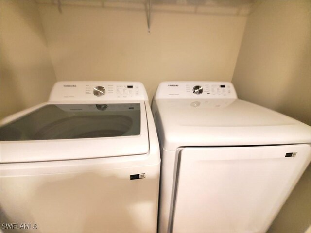 8657 Querce Ct, Naples, FL 34114 - laundry area with independent washer and dryer