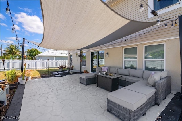 view of patio / terrace featuring outdoor lounge area and fence