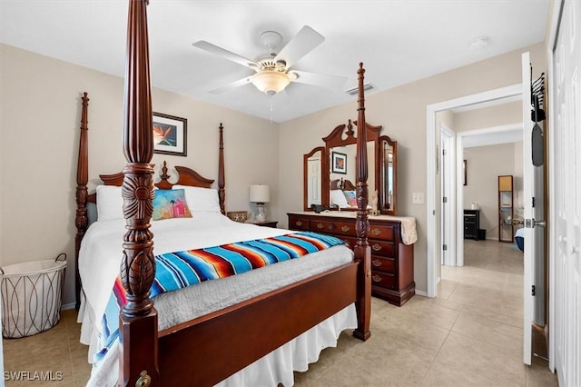 bedroom featuring light tile patterned flooring, visible vents, and ceiling fan