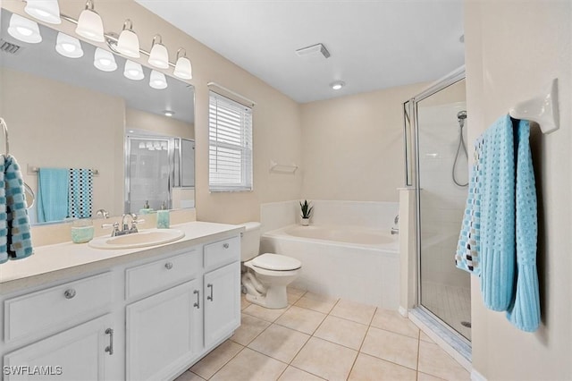 full bathroom with tile patterned floors, a stall shower, a bath, and vanity