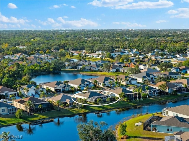 birds eye view of property featuring a water view and a residential view