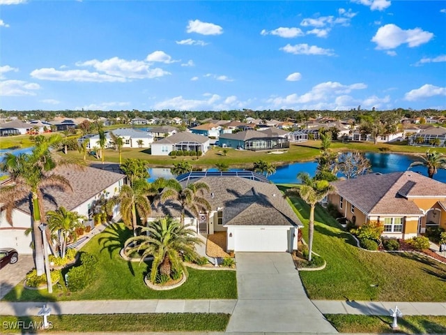 birds eye view of property featuring a residential view and a water view