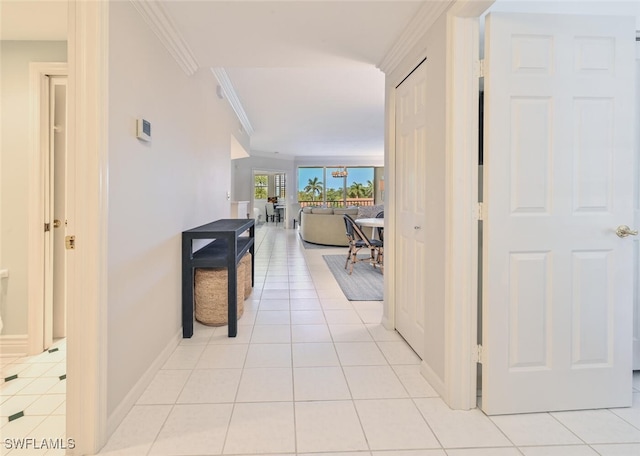 6549 Marissa Loop Unit 26, Naples, FL 34108 - corridor with crown molding, baseboards, and light tile patterned flooring