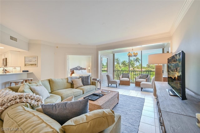 6549 Marissa Loop Unit 26, Naples, FL 34108 - living room featuring light tile patterned flooring, an inviting chandelier, ornamental molding, and visible vents