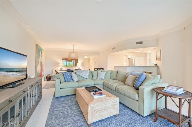 6549 Marissa Loop Unit 26, Naples, FL 34108 - living room featuring visible vents, crown molding, and light tile patterned floors