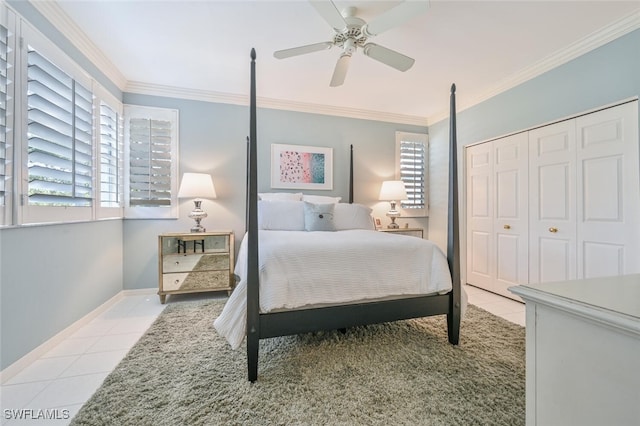 6549 Marissa Loop Unit 26, Naples, FL 34108 - bedroom with crown molding, ceiling fan, tile patterned floors, baseboards, and a closet