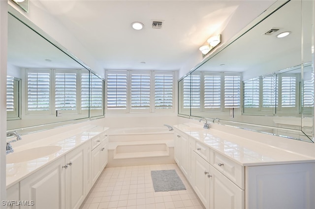 6549 Marissa Loop Unit 26, Naples, FL 34108 - bathroom with tile patterned flooring, visible vents, a bath, and vanity