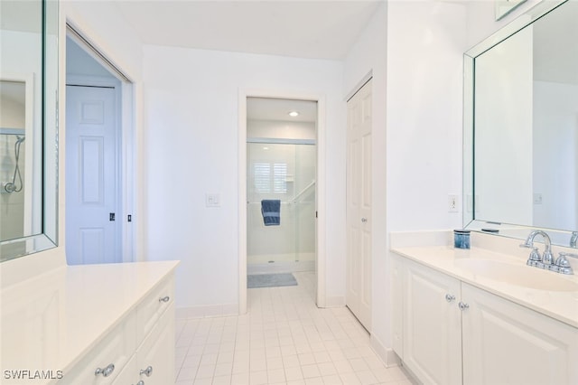 6549 Marissa Loop Unit 26, Naples, FL 34108 - bathroom featuring baseboards, a shower, tile patterned flooring, and vanity