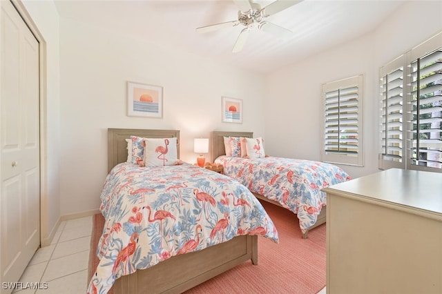 6549 Marissa Loop Unit 26, Naples, FL 34108 - bedroom with light tile patterned floors, ceiling fan, and a closet