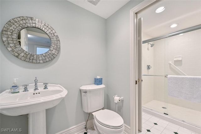6549 Marissa Loop Unit 26, Naples, FL 34108 - bathroom with toilet, recessed lighting, tile patterned flooring, and a stall shower