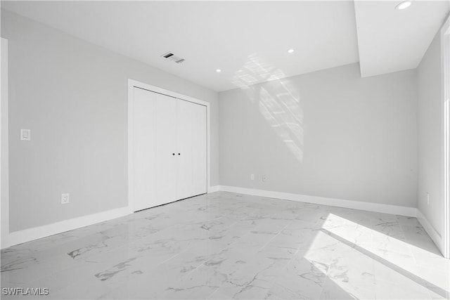 unfurnished bedroom with baseboards, visible vents, marble finish floor, and recessed lighting