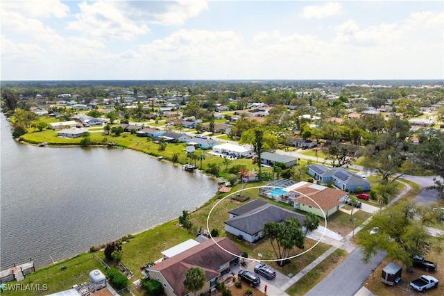 bird's eye view featuring a residential view and a water view
