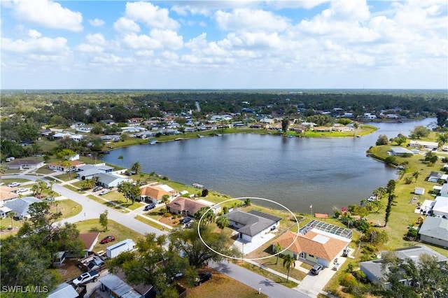 bird's eye view featuring a residential view and a water view