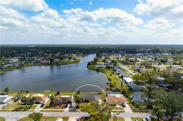 drone / aerial view featuring a residential view and a water view