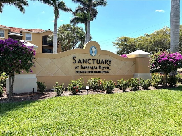 8687 River Homes Ln Unit 4107, Bonita Springs, FL 34135 - community / neighborhood sign featuring a lawn