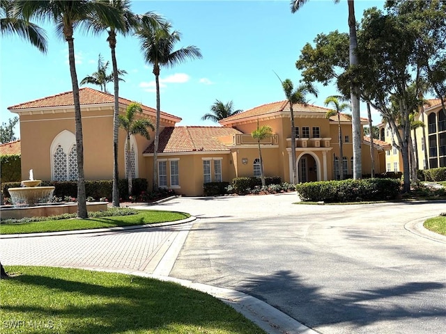 8687 River Homes Ln Unit 4107, Bonita Springs, FL 34135 - view of building exterior featuring curved driveway