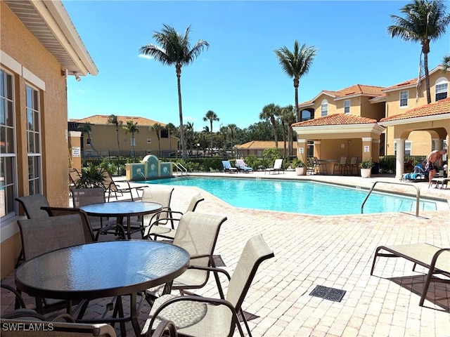 8687 River Homes Ln Unit 4107, Bonita Springs, FL 34135 - pool with fence and a patio