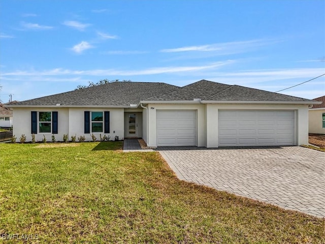 1904 NW 18th St, Cape Coral, FL 33993 - ranch-style home with roof with shingles, an attached garage, a front lawn, stucco siding, and decorative driveway