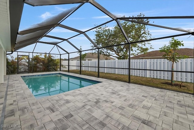 1904 NW 18th St, Cape Coral, FL 33993 - view of swimming pool with a fenced in pool, a patio, fence private yard, and glass enclosure