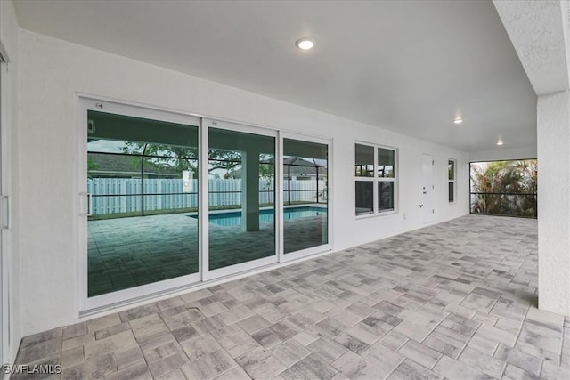 1904 NW 18th St, Cape Coral, FL 33993 - view of patio / terrace featuring a lanai, an outdoor pool, and fence