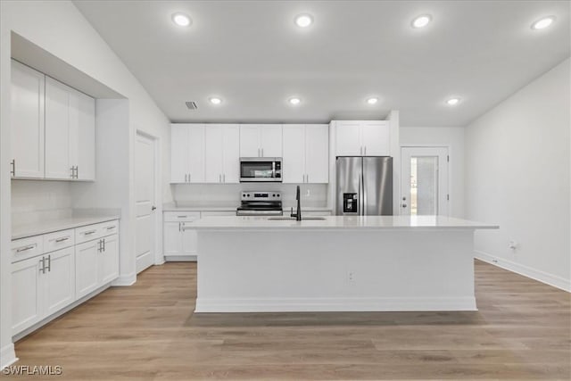 1904 NW 18th St, Cape Coral, FL 33993 - kitchen featuring white cabinets, appliances with stainless steel finishes, a sink, and light countertops