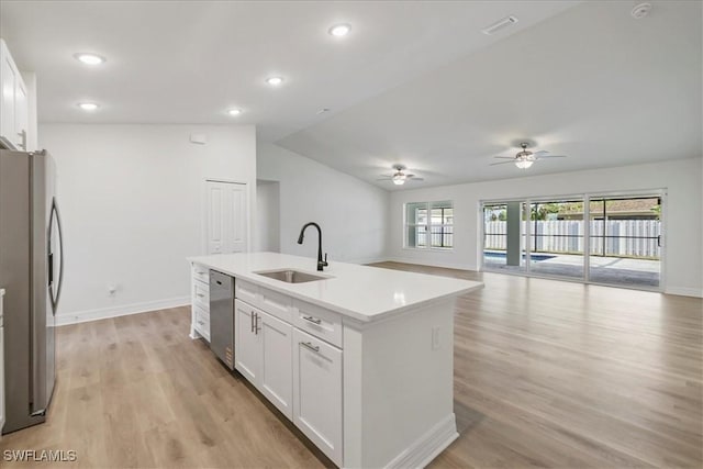 1904 NW 18th St, Cape Coral, FL 33993 - kitchen featuring ceiling fan, white cabinets, a sink, light wood-style flooring, and stainless steel appliances
