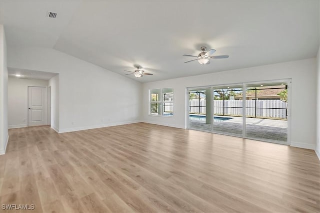 1904 NW 18th St, Cape Coral, FL 33993 - unfurnished living room with ceiling fan, light wood-style flooring, baseboards, vaulted ceiling, and visible vents