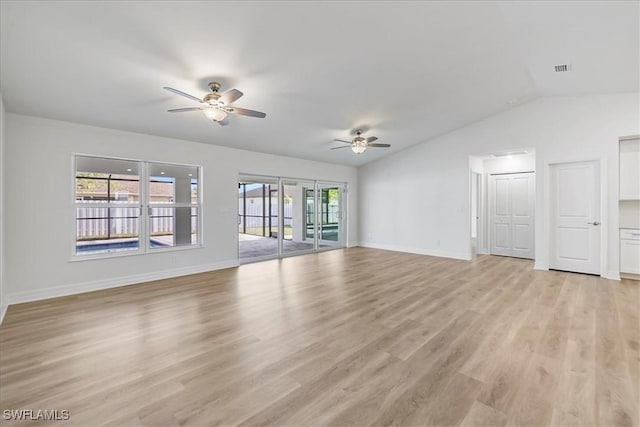 1904 NW 18th St, Cape Coral, FL 33993 - unfurnished living room with a ceiling fan, baseboards, lofted ceiling, and light wood-style floors
