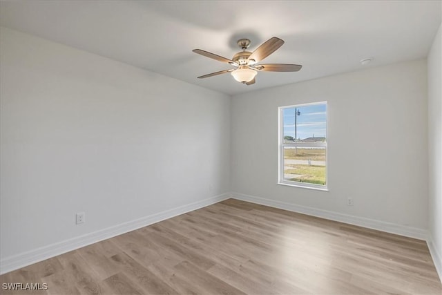 1904 NW 18th St, Cape Coral, FL 33993 - empty room featuring baseboards, light wood finished floors, and ceiling fan