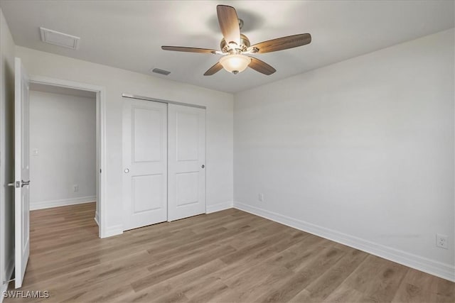 1904 NW 18th St, Cape Coral, FL 33993 - unfurnished bedroom with a closet, baseboards, visible vents, and light wood-style floors
