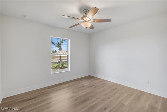 1904 NW 18th St, Cape Coral, FL 33993 - spare room with baseboards, ceiling fan, and light wood-style floors