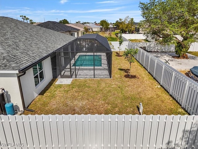 1904 NW 18th St, Cape Coral, FL 33993 - view of swimming pool featuring a fenced backyard, a fenced in pool, a lawn, and a patio