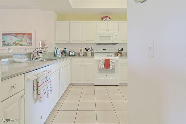 4690 Turnberry Lake Dr Unit 104, Estero, FL 33928 - kitchen with a sink, light tile patterned floors, white cabinets, and white appliances