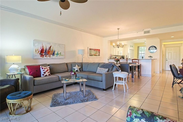 4690 Turnberry Lake Dr Unit 104, Estero, FL 33928 - living room with light tile patterned flooring, visible vents, ornamental molding, and ceiling fan with notable chandelier