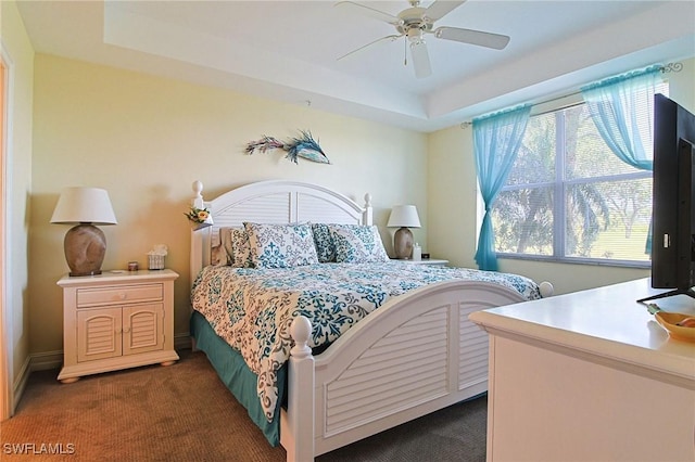 4690 Turnberry Lake Dr Unit 104, Estero, FL 33928 - bedroom featuring a raised ceiling, a ceiling fan, and carpet flooring