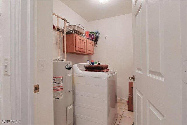 4690 Turnberry Lake Dr Unit 104, Estero, FL 33928 - laundry area featuring cabinet space, independent washer and dryer, light tile patterned floors, and electric water heater