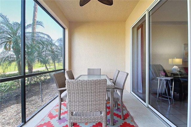 4690 Turnberry Lake Dr Unit 104, Estero, FL 33928 - sunroom featuring a ceiling fan, a textured ceiling, and plenty of natural light