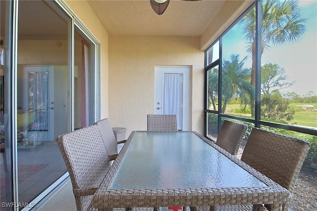4690 Turnberry Lake Dr Unit 104, Estero, FL 33928 - sunroom / solarium featuring a ceiling fan and outdoor dining space