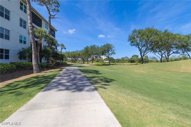 4690 Turnberry Lake Dr Unit 104, Estero, FL 33928 - surrounding community featuring a lawn
