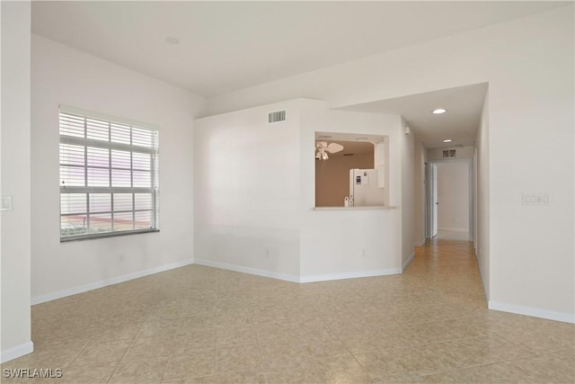25073 Peacock Ln Unit 102, Naples, FL 34114 - unfurnished room featuring baseboards and recessed lighting
