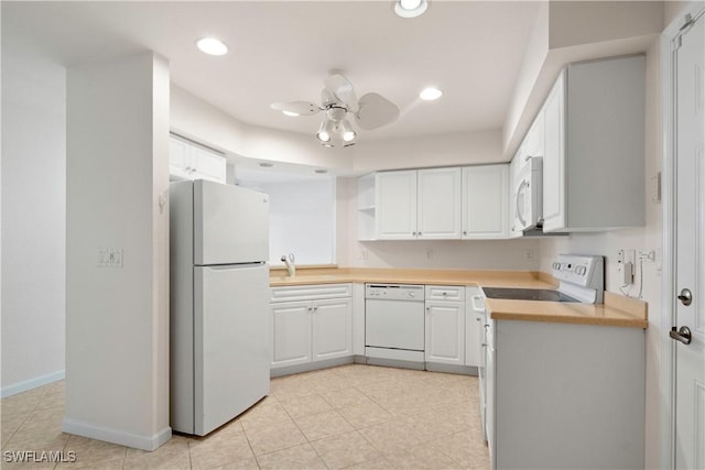 25073 Peacock Ln Unit 102, Naples, FL 34114 - kitchen with white appliances, a sink, a ceiling fan, light countertops, and open shelves