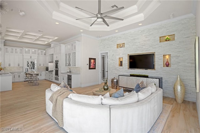 10371 Via Anacapri Ct, Miromar Lakes, FL 33913 - living room with recessed lighting, ceiling fan, beverage cooler, a raised ceiling, and light wood-style floors