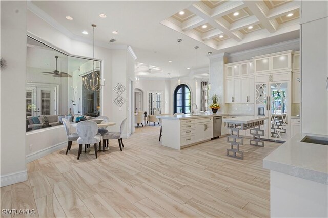 10371 Via Anacapri Ct, Miromar Lakes, FL 33913 - kitchen featuring stainless steel dishwasher, ceiling fan, a peninsula, open floor plan, and crown molding