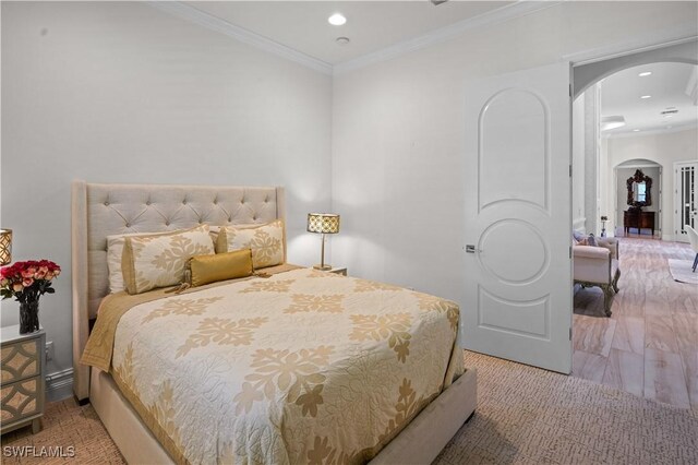 10371 Via Anacapri Ct, Miromar Lakes, FL 33913 - bedroom with arched walkways, crown molding, and recessed lighting