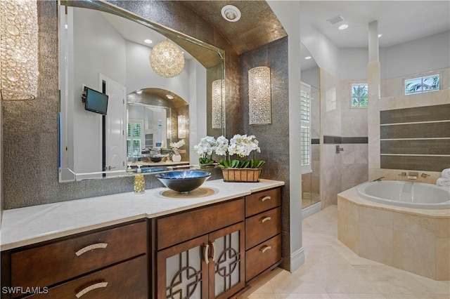10371 Via Anacapri Ct, Miromar Lakes, FL 33913 - bathroom featuring a walk in shower, a bath, visible vents, tile patterned flooring, and vanity