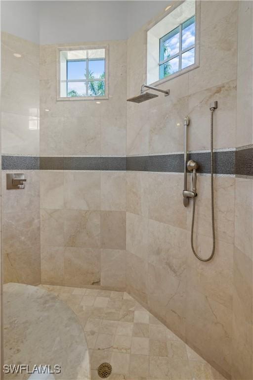 10371 Via Anacapri Ct, Miromar Lakes, FL 33913 - full bathroom with a tile shower